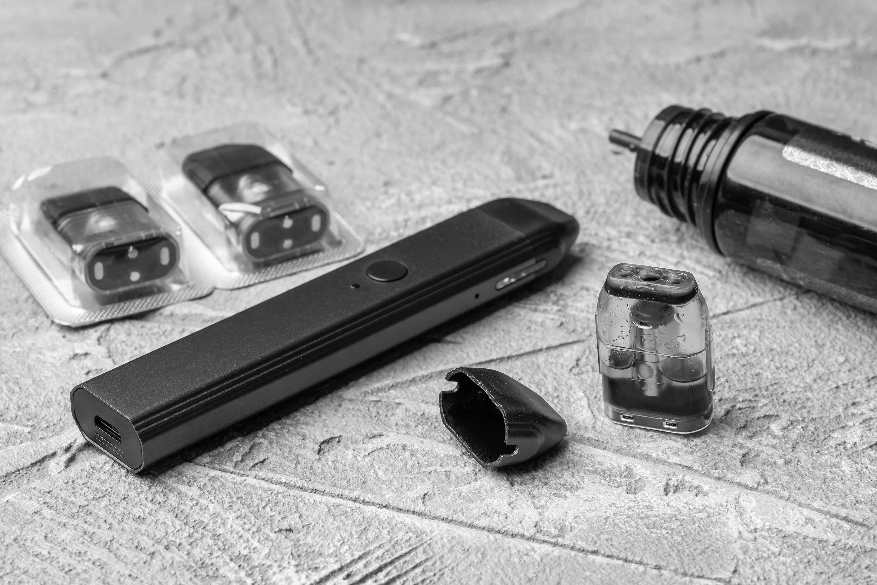Black and white image of pod device and parts
