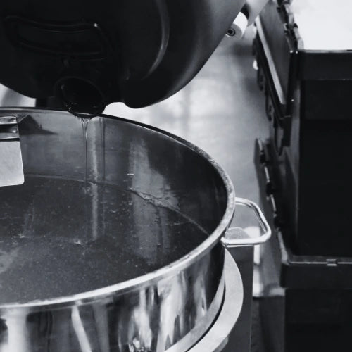 A black and white image of e-liquid mixing