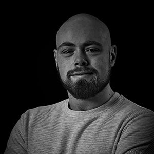 A black and white picture of the author Ollie Norman