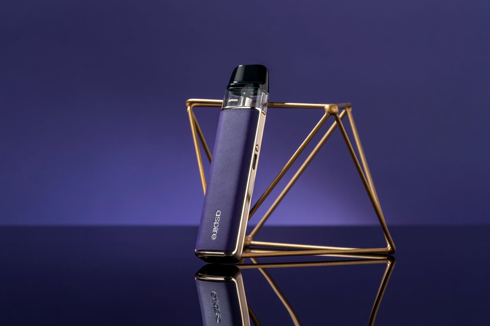 Purple Aspire Loomix device against gold foundation