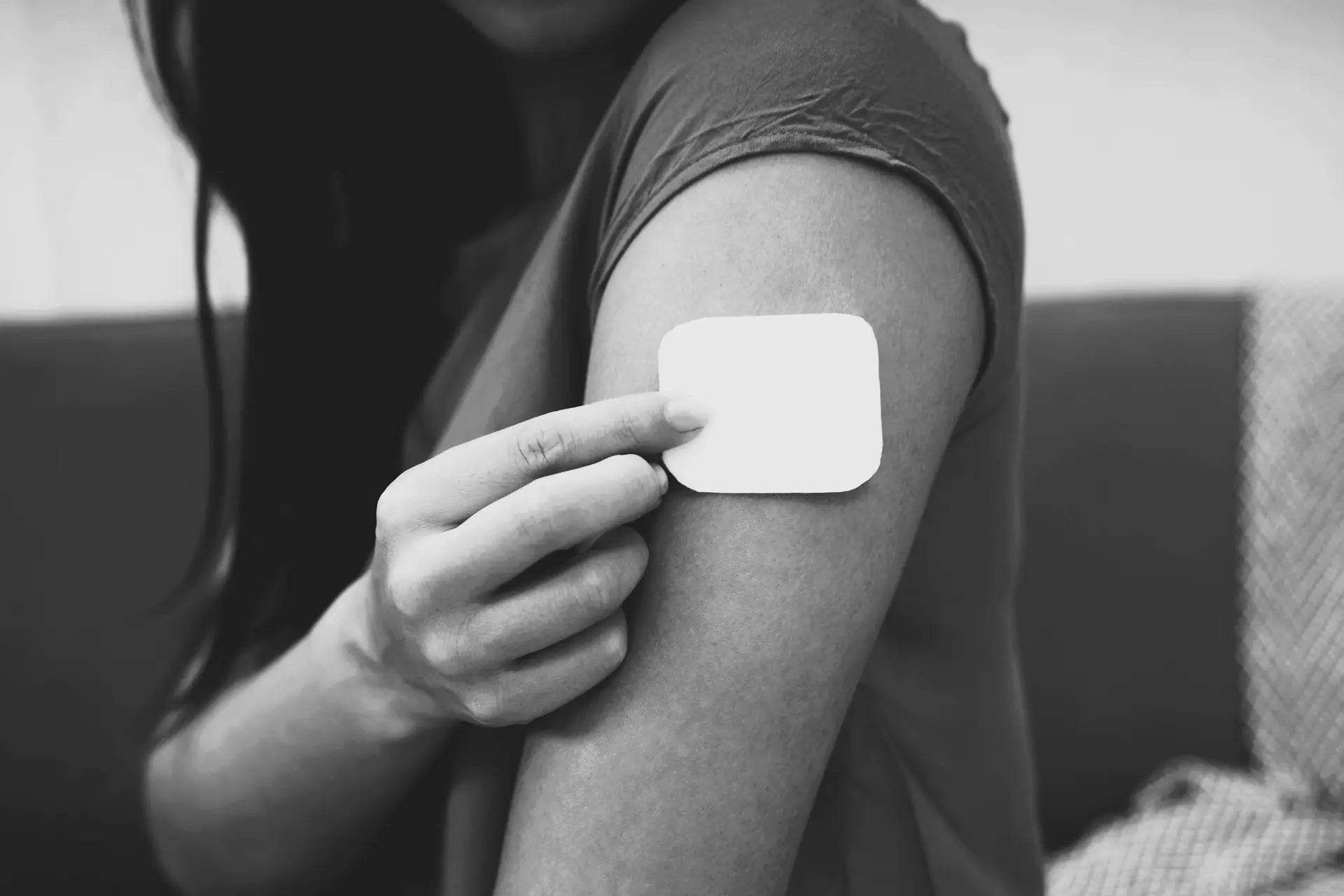 Person with a nicotine patch on their arm