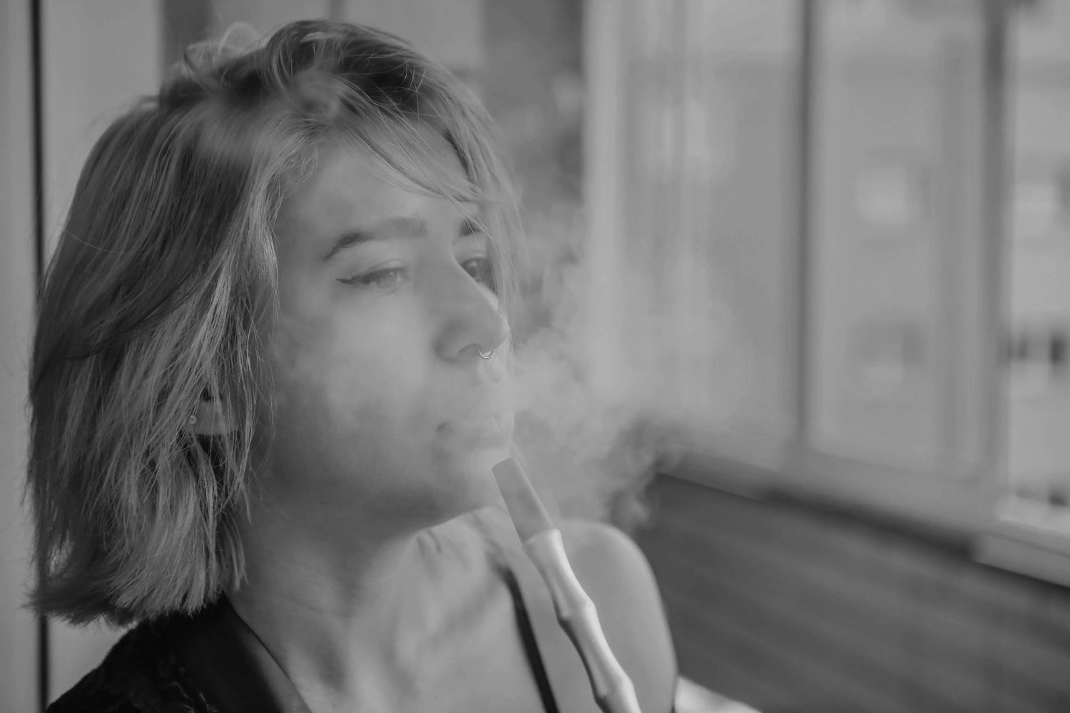 Person vaping black and white image 